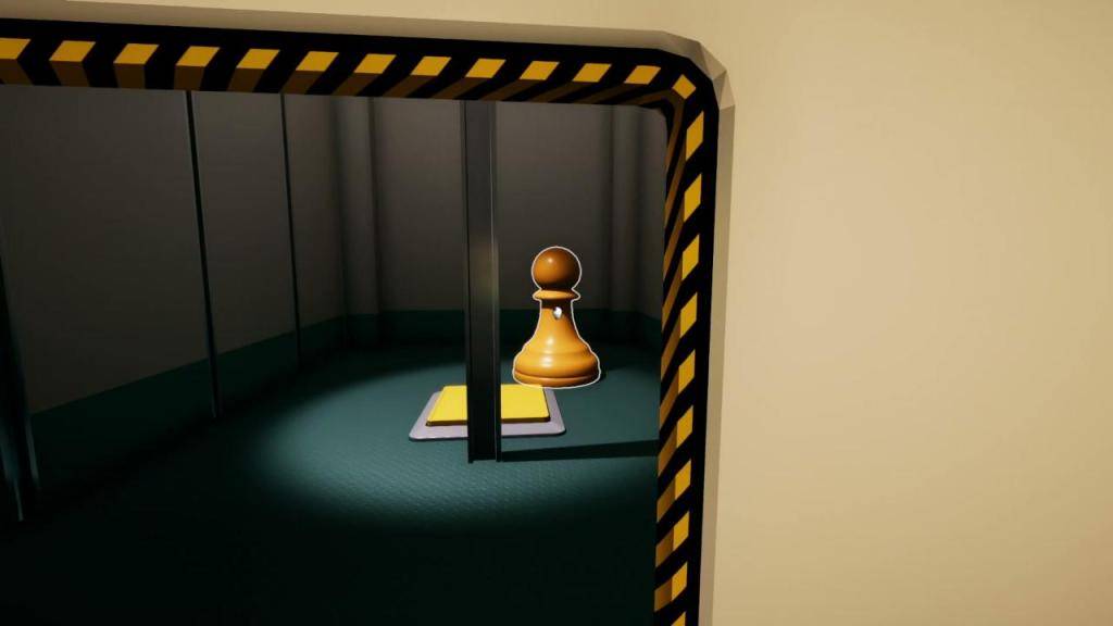 A chess piece being held near a yellow button. 